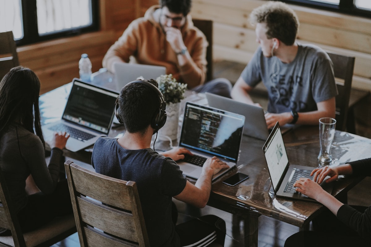 Analytics team collaborating on conversational AI deployment